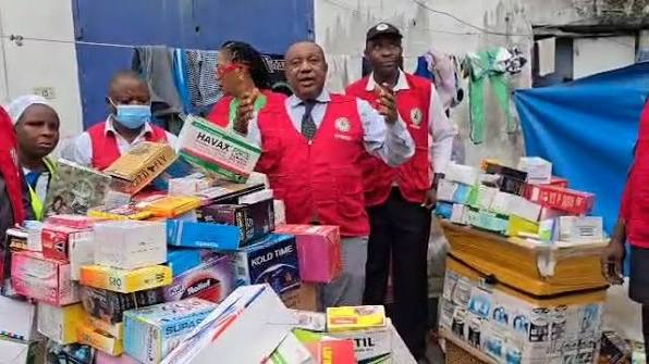 NAFDAC officials inspecting alcoholic beverages in a Nigerian market